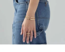 Bracciale rigido line in bronzo dorato Unoaerre